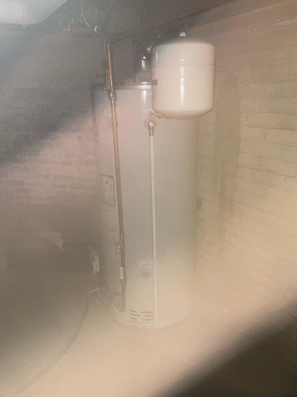 Conducted routine inspection of water heater system including examination of tank condition, expansion tank, pressure relief valve, and all connection points. Verified proper installation of venting components and copper piping. System appears to be functioning normally with no visible leaks or damage detected.
