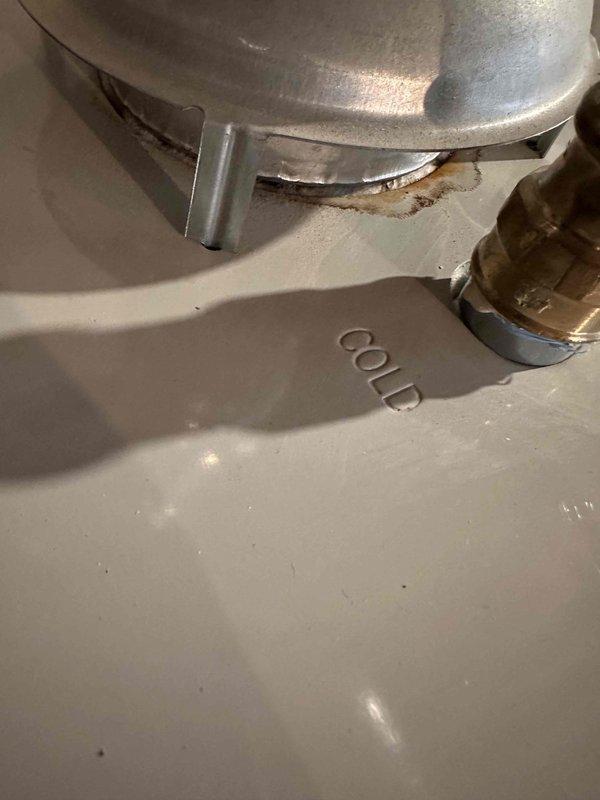 Performed annual inspection and tune-up on Lennox steam boiler system and hot water tank. Identified minor corrosion at the cold water connection point requiring monitoring. All other components functioning properly with no immediate service requirements.