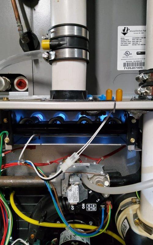 Completed scheduled heating tune-up service on residential furnace system. Performed comprehensive inspection of gas valve assembly, burner elements, and electrical connections including yellow, red, green, blue and white wiring. All components functioning properly with no issues identified; system is operating at optimal efficiency for the heating season.