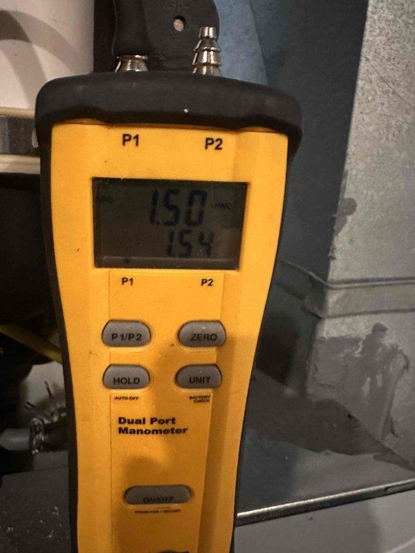 Performed routine maintenance on two natural gas furnace systems. Identified and documented active water leakage from copper pipe connection with brass fitting. Conducted gas pressure testing with dual port manometer, recording readings of 150/154.