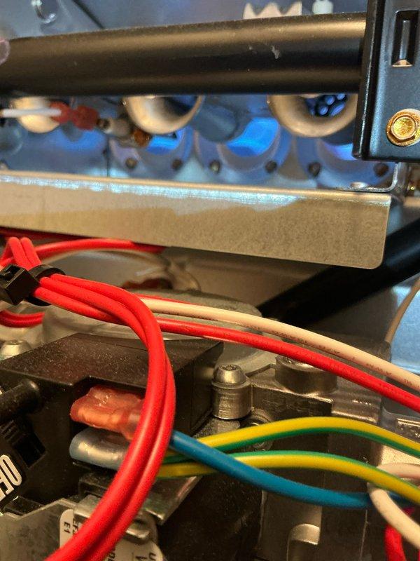 Performed scheduled Home Plan Heating Tune-Up service on the heating system. Inspected blower wheel assembly for proper operation and cleanliness. Verified proper ignition sequence and examined burner assembly with flames present, confirming normal operation of the gas furnace. All electrical connections were inspected and found to be secure with no signs of deterioration.