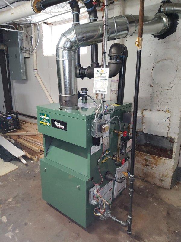 Successfully completed installation of new steam gas boiler system with integrated backflow preventer, automatic water feeder, and thermostat. Utilized existing 2.5" black pipe infrastructure and main steam vent while ensuring proper connection to the building's plumbing and ventilation systems. System was thoroughly tested and is now operational with all components properly installed according to manufacturer specifications.