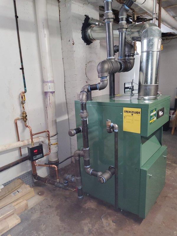 Successfully completed installation of new steam gas boiler system with integrated backflow preventer, automatic water feeder, and thermostat. Utilized existing 2.5" black pipe infrastructure and main steam vent while ensuring proper connection to the building's plumbing and ventilation systems. System was thoroughly tested and is now operational with all components properly installed according to manufacturer specifications.