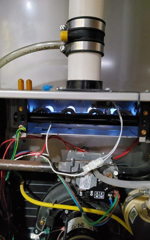 Performed comprehensive heating system tune-up per maintenance plan. Conducted combustion analysis showing CO levels at 10 ppm and CO2 at 6.6% with stack temperature at 104.8°F, all within acceptable parameters. Identified potential mold growth near unit requiring attention; recommended remediation to prevent system contamination and indoor air quality issues.