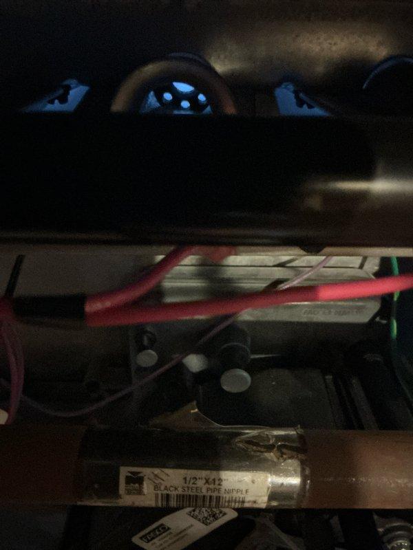 Completed scheduled maintenance on 14-year-old furnace. Inspected black steel pipe nipple connections and verified proper installation. Examined blower wheel assembly and electrical components, confirming system functionality for heating season.