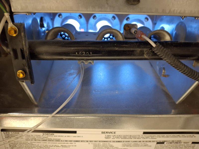 Performed routine maintenance on 5-year-old gas furnace. Conducted combustion analysis using UEI digital analyzer confirming proper flame characteristics and operation. Inspected burner assembly (unit #16201) with all flames burning blue and even, indicating complete combustion and optimal performance.