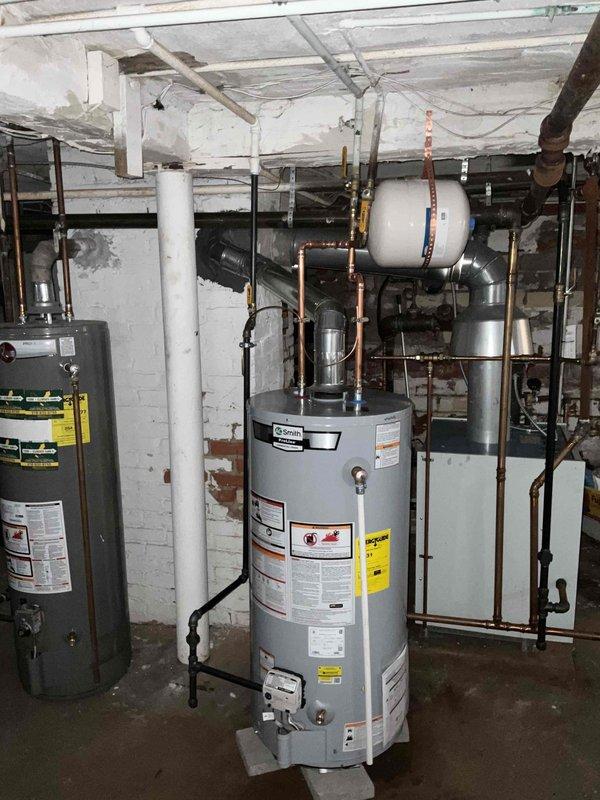 Successfully replaced aging water heater in basement mechanical room. Installed new 3/4 water heater with proper connections to existing copper piping and ventilation system. Ensured all fittings were secure and system was operational before completing the job.
