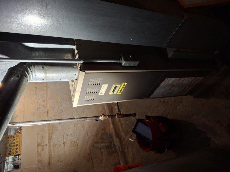 Responded to service call for 20-year-old furnace not operating properly. Inspection revealed dusty but functional burners with proper blue flame pattern. System was tested and confirmed to be operating within normal parameters; no immediate repairs needed at this time.