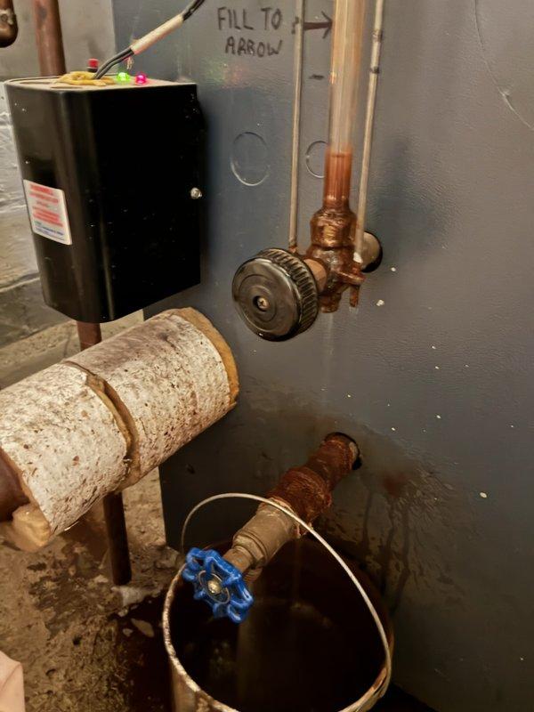 Responded to service call for 16-year-old Weil-McLain boiler with corroded and leaking sight glass assembly. Upon inspection, confirmed significant corrosion at connection points and replaced the damaged sight glass assembly to restore proper operation and eliminate leakage. System was tested and verified to be functioning correctly with no further leaks observed.