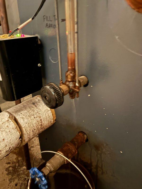 Responded to service call for 16-year-old Weil-McLain boiler with corroded and leaking sight glass assembly. Upon inspection, confirmed significant corrosion at connection points and replaced the damaged sight glass assembly to restore proper operation and eliminate leakage. System was tested and verified to be functioning correctly with no further leaks observed.
