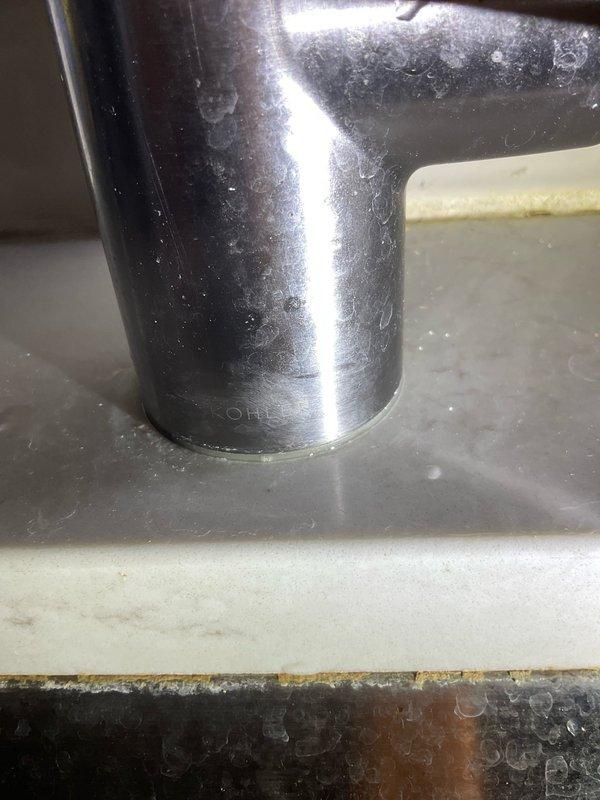 Responded to service call for leaky faucet in century-old residential property. Upon inspection, identified mineral buildup in the aerator screen and wear on valve components causing the leak. Disassembled fixture, cleaned mineral deposits, replaced worn gaskets and reassembled, confirming proper operation with no further leakage.