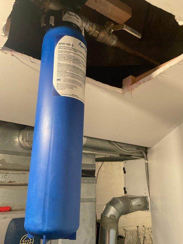 Replaced master shower valves through front access point, requiring precision cutting through marble tile surface. Installation included proper fitting of brass inlet valves and chrome control valve assembly. Also serviced and verified proper connection of the AP917HD-S water filtration system in utility area.