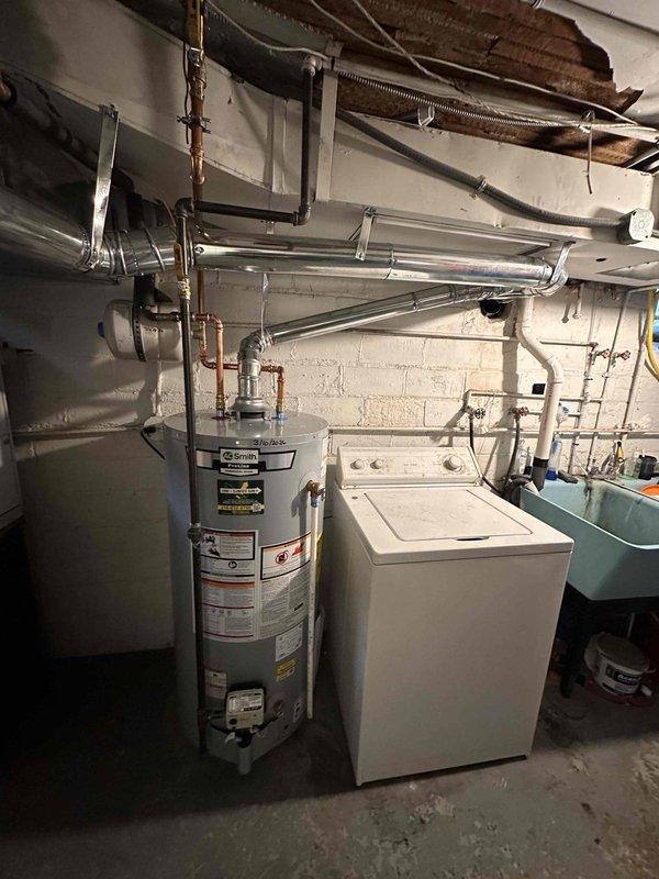 Successfully completed comprehensive HVAC system replacement including furnace, air conditioning unit, and water heater installation. Modified return drop and overhead collector box to 10x24 specifications and added 1410. Properly positioned outdoor condenser unit on gravel base with appropriate electrical connections and installed new water heater with all necessary plumbing connections in basement utility area.