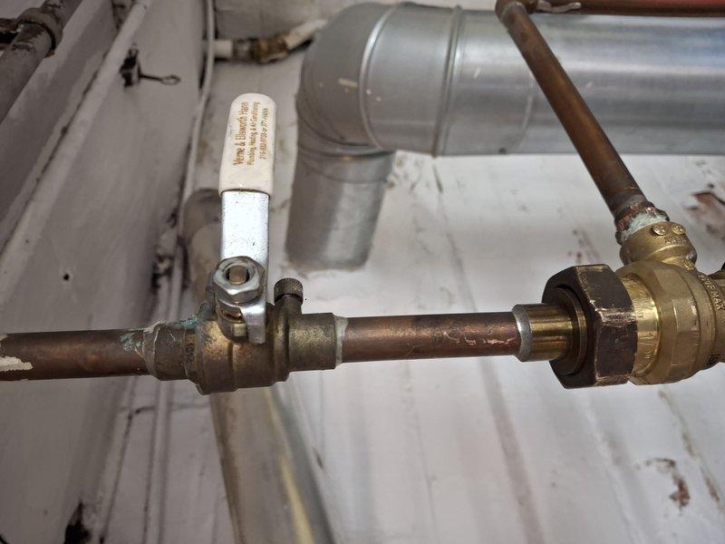 Performed scheduled maintenance on 12+ year old boiler system per service agreement. Inspected copper piping, brass shut-off valve, and associated fittings, noting some normal age-related verdigris on connections. Examined coil assembly and verified proper operation of mechanical components with no immediate concerns identified.
