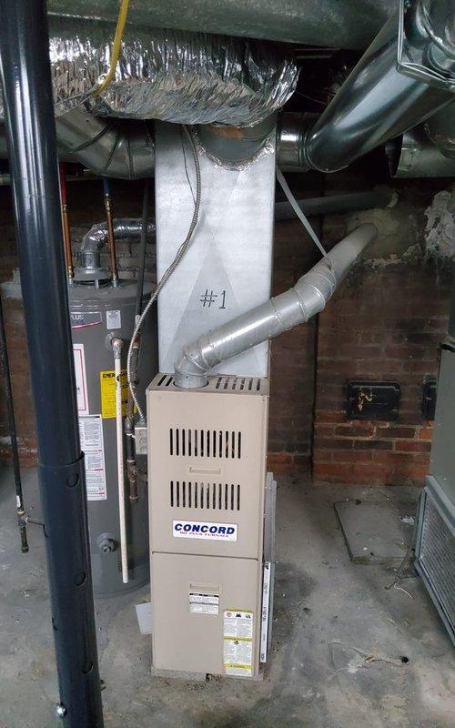 Performed comprehensive service certification on six gas furnaces at commercial property. Inspected Concord unit and associated ductwork in utility room, noting proper installation of ventilation components and confirming operational status. Visual inspection revealed no immediate safety concerns with the equipment or surrounding mechanical systems.
