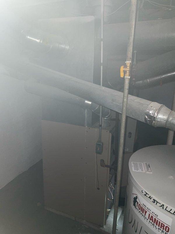 Performed comprehensive service certification on six gas furnaces at commercial property. Inspected Concord unit and associated ductwork in utility room, noting proper installation of ventilation components and confirming operational status. Visual inspection revealed no immediate safety concerns with the equipment or surrounding mechanical systems.