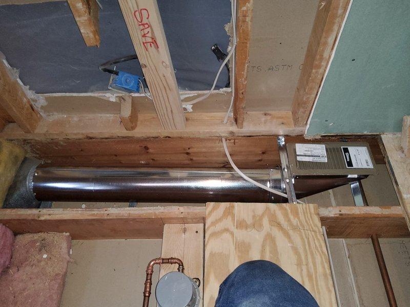 Successfully extended existing ductwork by installing 6" diameter pipes (24" and 60" sections) with a 4x10x6 left-hand center boot to redirect airflow along the wall. Completed installation with a 4x10 white floor register, ensuring proper integration with the existing HVAC system within the exposed framing structure.