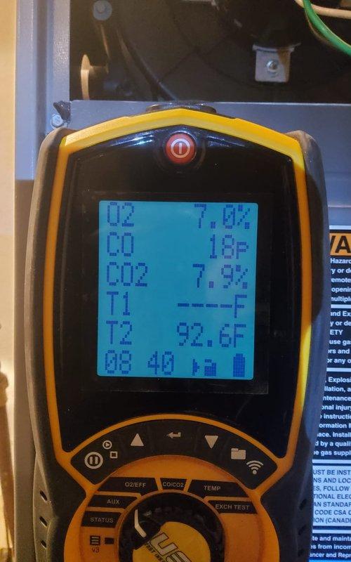 Performed comprehensive furnace tune-up service, conducting combustion analysis with readings of 7.0% O2, 18 ppm CO, and 7.9% CO2 at stack temperature of 92.6°F, indicating unit is operating within acceptable parameters. Verified thermostat functionality, currently set at 66°F with ambient temperature reading 76°F.