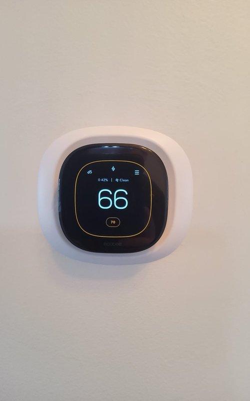 Performed comprehensive furnace tune-up service, conducting combustion analysis with readings of 7.0% O2, 18 ppm CO, and 7.9% CO2 at stack temperature of 92.6°F, indicating unit is operating within acceptable parameters. Verified thermostat functionality, currently set at 66°F with ambient temperature reading 76°F.