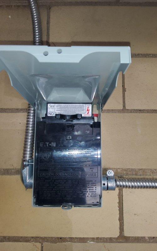 Performed diagnostic check on Reznor electric garage heater as requested. Inspected unit mounted on brick wall and verified electrical connections at Eaton disconnect switch. Confirmed proper operation of heating element and ventilation system.