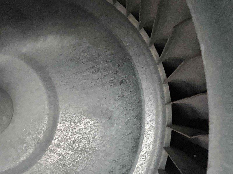 Performed comprehensive tune-up on residential heating system of indeterminate age. Inspected blower wheel assembly and heat exchanger, noting normal dust accumulation but proper operation of burner ports with consistent blue flame pattern. System functioning within normal parameters after service.