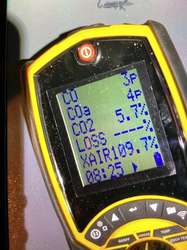 Performed scheduled heating maintenance on 15-year-old boiler system. Conducted comprehensive combustion analysis with readings of CO/CO2 levels, efficiency loss percentage, and excess air ratio (109.7% XAIR). Inspected connection points and wiring harness at control assembly; all components functioning within normal parameters.