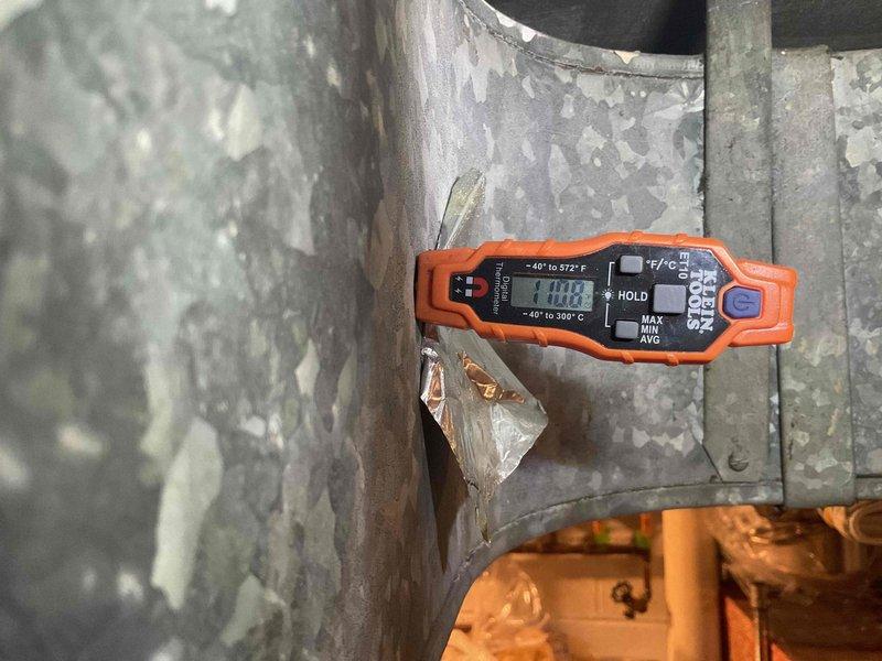 Completed heating tune-up service on gas furnace system. Inspected burner assembly confirming proper blue flame pattern and verified heat exchanger operation with temperature reading of 110.0°F at supply plenum. All electrical connections, gas valve, and PVC venting system were examined and found to be in normal working condition.