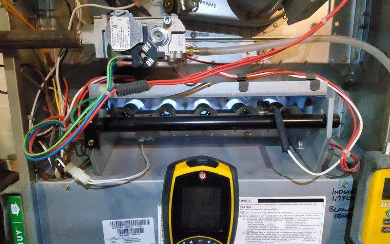 Performed comprehensive MVP tune-up on HVAC system, including inspection of gas valve assembly, control board, and electrical components with multimeter diagnostics. Examined blower wheel assembly which showed proper condition with no dust accumulation or mechanical issues; all components verified to be functioning within normal parameters.