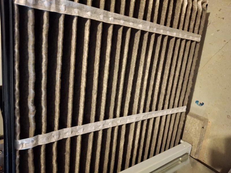 Performed scheduled home plan heating tune-up service. Inspected ventilation components including the heat exchanger fins which appeared in good condition. Replaced severely clogged air filter that showed extensive dust and debris accumulation, which was affecting system efficiency and air quality.