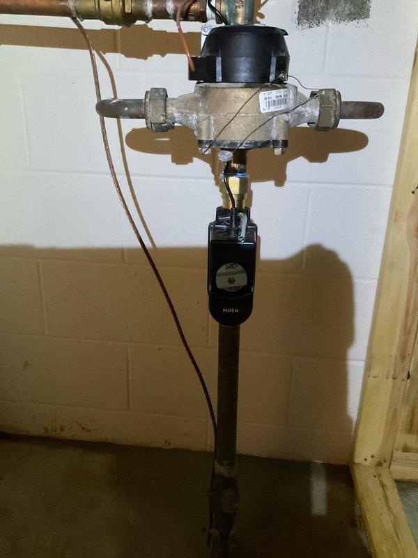 Successfully installed a Moen whole house shut-off valve system to replace the existing water control assembly. Work included connecting the new valve to the existing copper piping infrastructure and mounting the electronic Moen control module to the wall. System was tested and confirmed operational prior to completion.