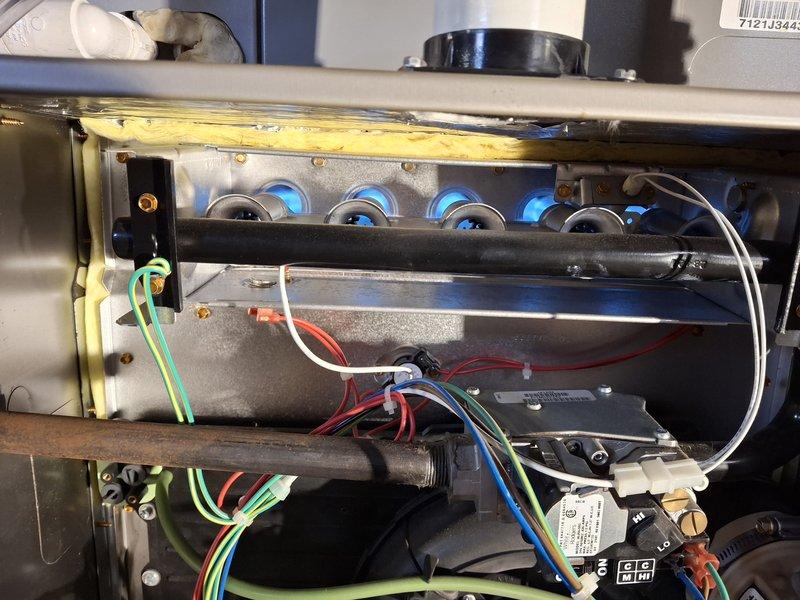 Performed scheduled Home Plan Heating Tune-Up on gas-fired steam boiler system. Inspected combustion chamber and verified proper blue flame pattern indicating efficient operation. Conducted comprehensive diagnostic testing using UEi C161 analyzer to measure temperature and pressure parameters, confirming all readings within manufacturer specifications.