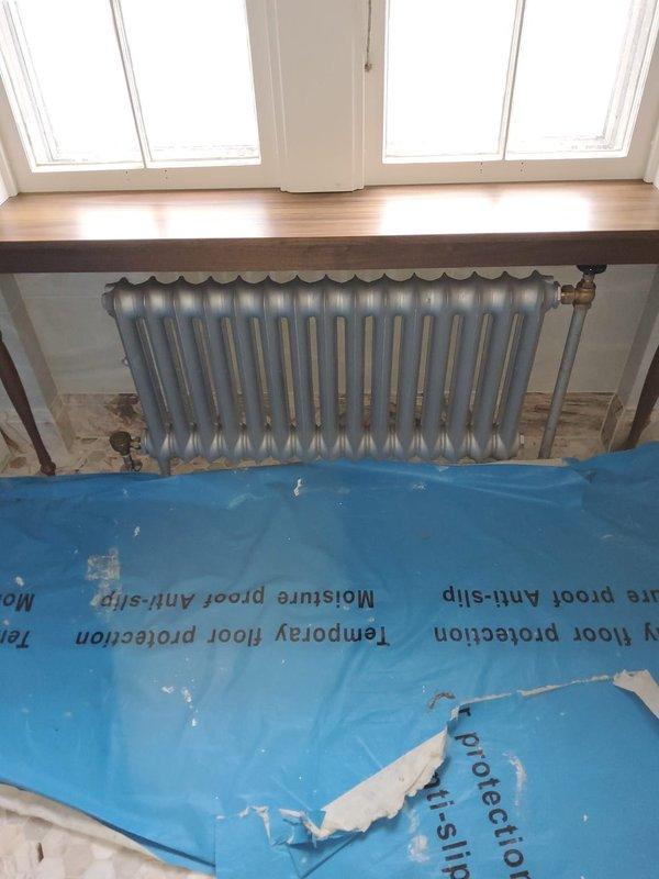 Successfully completed reinstallation of four steam radiators, including replacement of all valves and traps. Work performed by two technicians over 5-6 hours with proper floor protection in place during the renovation process.