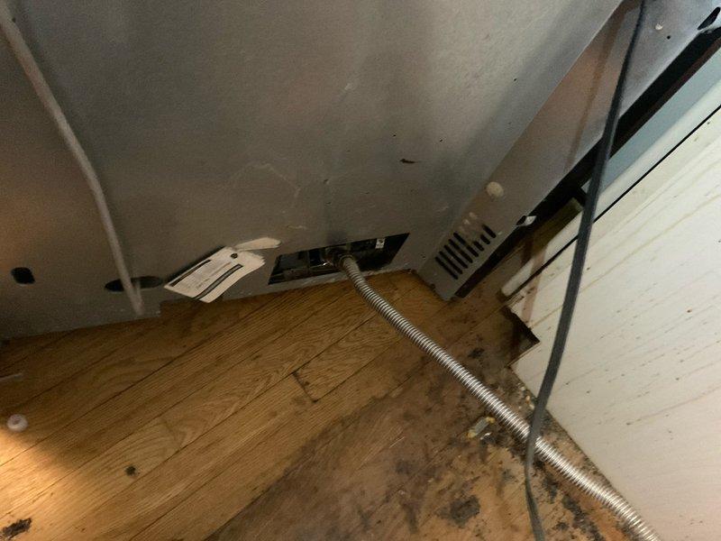 Performed gas leak investigation on kitchen stove in century home after customer reported potential gas leak. Conducted comprehensive pressure test on gas line servicing the stove, identifying minor leak at connection point where flexible gas line meets appliance. Tightened connection and applied leak detection solution to verify repair, then performed follow-up pressure test confirming system integrity and safe operation.
