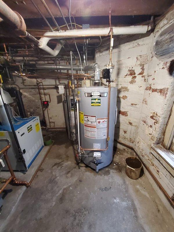 Responded to no hot water service call and found a leaking A.O. Smith hot water tank manufactured in 2006. Installed new water heater unit, including proper connection of copper supply lines, drainage, and metal vent piping. System was tested and confirmed to be functioning correctly with no leaks.