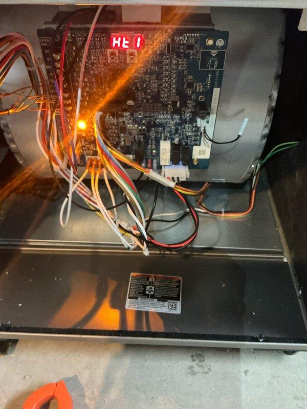 Responded to service call for no heat issue on gas furnace under 1 year old after power outage. Diagnostic inspection revealed error code "HEO" displayed on control board with amber indicator light illuminated. Inspected gas valve assembly, flame sensors, and wiring connections; reset system and restored proper heating operation. Unit now functioning normally within manufacturer specifications.