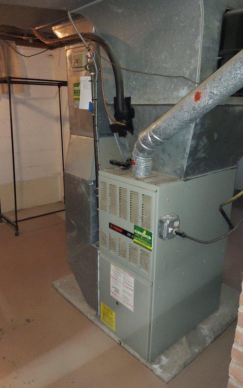 Responded to call for 10+ year old gas furnace blowing cold air. Performed combustion analysis with digital analyzer showing O2 at 8.4%, CO at 7ppm, CO2 at 7.1%, and stack temperature of 358°F. Inspection of furnace installation and connections confirmed proper setup with appropriate ductwork and drainage systems.