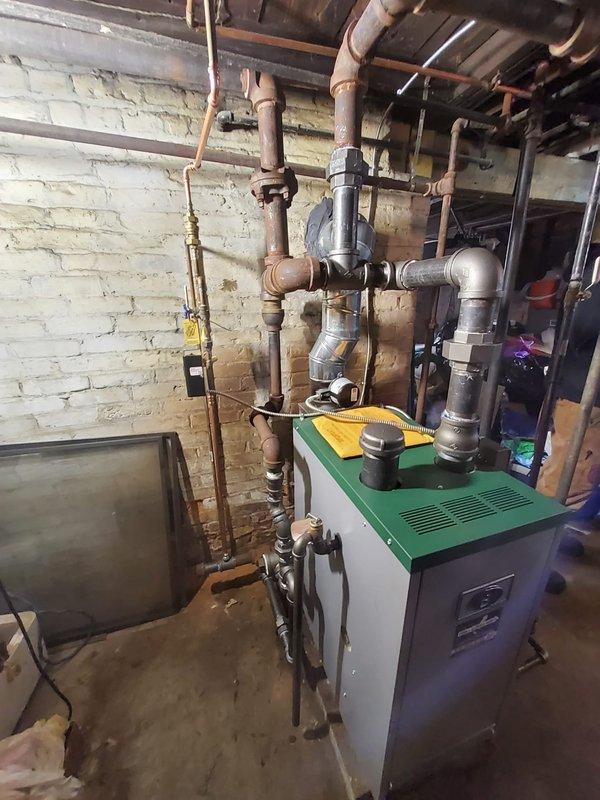 Successfully installed new gas steam boiler system in basement, including replacement of vapor stat, feeder, boiler feed pump (BFP), and thermostat. System was properly connected to existing piping infrastructure, with all components tested and verified operational after installation.