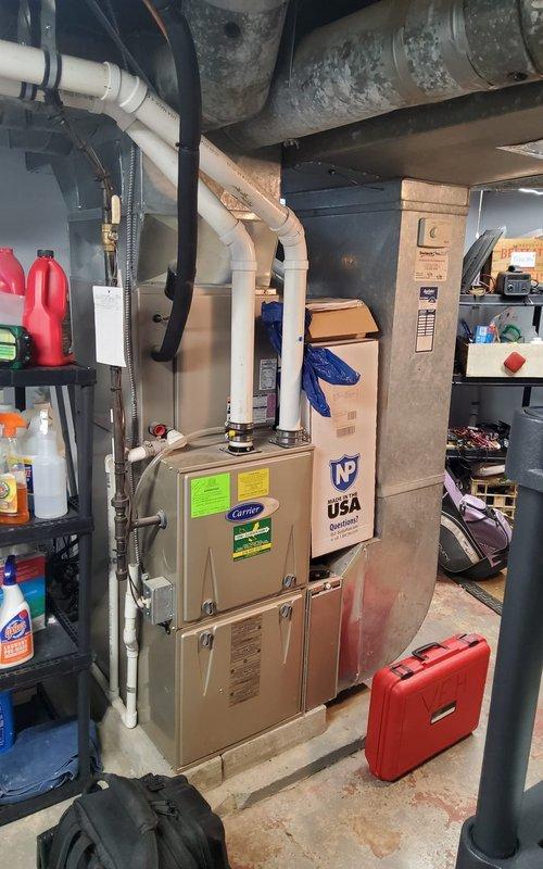 Performed annual maintenance on 5-year-old furnace system with Aprilaire humidifier attachment. Inspected PVC ventilation ducts, checked connections to metal ductwork, and verified proper operation of condensate drainage system. Installed new thermostat as requested by customer.