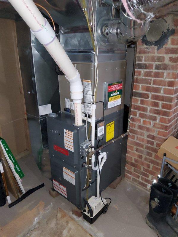 Replaced damaged air conditioning system including both condenser and evaporator coil. Extended refrigerant lineset and relocated condenser to new position along side of sunroom for improved performance. Verified proper electrical connections at service panel and tested system for optimal operation after installation was complete.