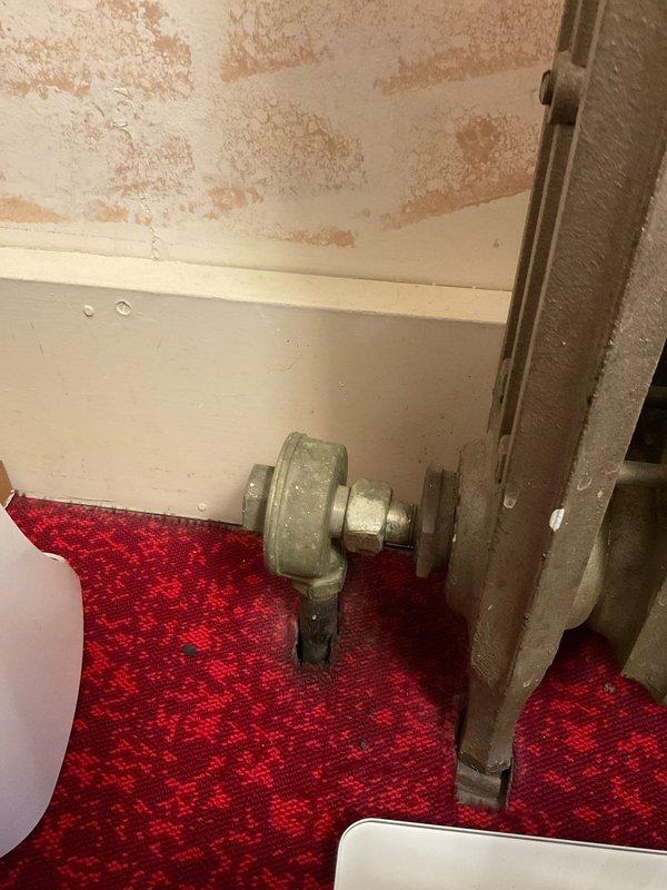 Responded to service call for clogged sink drain and slow leak in 55-year-old home. Inspected aging plumbing system, including connection to cast iron radiator with valve assembly in bathroom. Successfully cleared drain blockage and repaired leak at pipe fitting, restoring normal drainage and eliminating water seepage.
