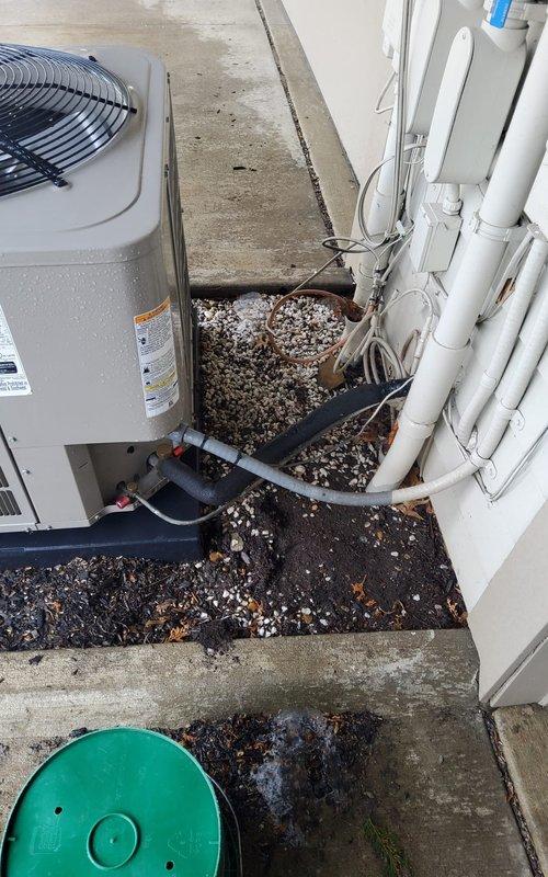 Performed scheduled cooling maintenance service on residential HVAC system between 12-4pm after providing call ahead notice. Inspected and serviced indoor air handler/furnace unit with associated PVC venting and electrical connections in mechanical room. Examined outdoor condensing unit mounted on concrete pad, noting proper installation of refrigerant lines and condensate drainage system, with all components functioning within specifications after service.