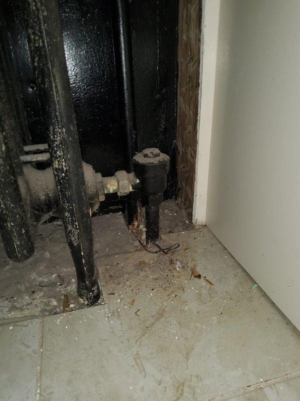 Replaced main ventilation component during warranty service. Installation included refitting black metal pipes with proper valve connections and securing junction points at wall openings. System now operating at optimal efficiency with all connections properly sealed.