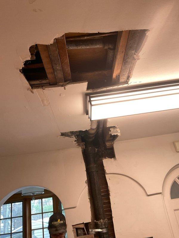 Completed stack work involving extensive opening of wall and ceiling to access vertical plumbing lines and disposal system. Exposed and evaluated multiple pipe runs through joists, with particular attention to the vertical waste stack. Will coordinate with office regarding potential need for additional time to complete the repair.