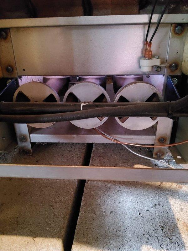 Performed scheduled heating tune-up on steam boiler system. Inspected and cleaned burner assembly, verified proper flame pattern across all three burners, and examined blower motor and fan assemblies for proper operation. System now operating at optimal efficiency with no safety concerns noted.