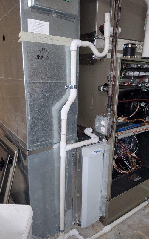 Responded to warranty service call regarding noise from recently installed furnace. Inspected system and leveled HVAC ductwork using spirit level. Checked and secured PVC condensate drainage system connected to the air handler unit (Filter #210), ensuring proper connection to condensate pump and verifying all seams on metal ductwork were correctly sealed with metallic tape.