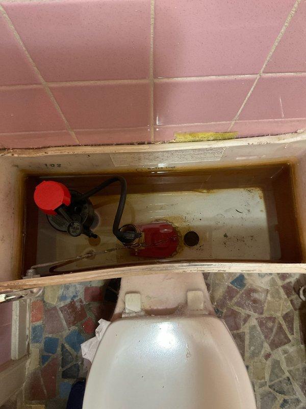 Diagnosed and repaired running toilet issue by replacing worn flapper valve and fill valve assembly due to significant mineral buildup and deterioration. Cleaned sediment from tank interior and adjusted water level to proper height. Verified proper operation with multiple test flushes and confirmed no leaks at supply line connection.