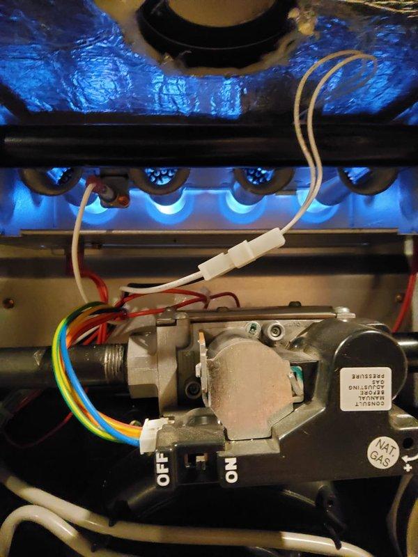 Diagnosed water leak in 2-year-old furnace showing significant rust accumulation beneath condensate trap. Inspected gas valve assembly and verified proper burner operation. Replaced damaged condensate trap and connecting hose, resolving the moisture issue causing corrosion to the furnace base.