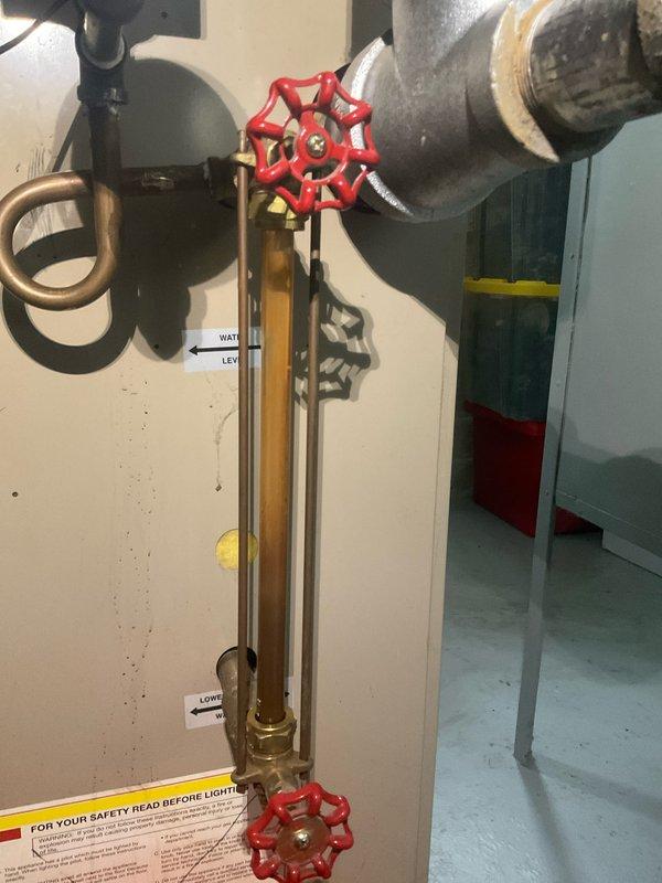 Performed scheduled maintenance on 21-year-old steam boiler system. Inspected pressure gauge, water level indicators, and safety controls for proper operation. Checked all valves and connections for leaks; verified proper venting of exhaust system and confirmed condensate drain line was clear and functioning correctly.