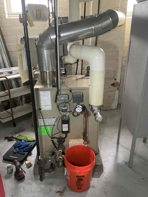 Performed scheduled maintenance on 21-year-old steam boiler system. Inspected pressure gauge, water level indicators, and safety controls for proper operation. Checked all valves and connections for leaks; verified proper venting of exhaust system and confirmed condensate drain line was clear and functioning correctly.