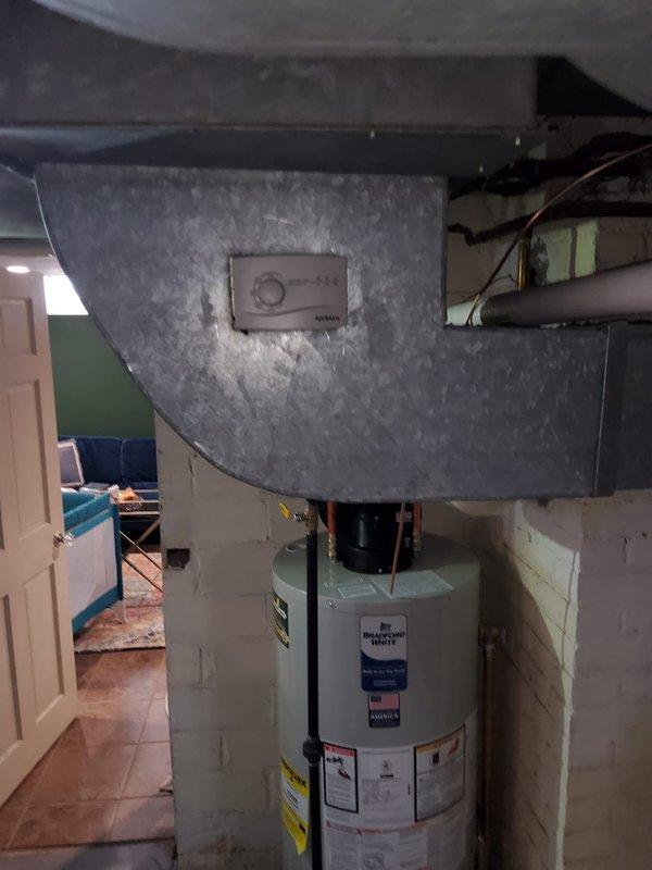 Completed furnace replacement with associated water heater installation in basement mechanical room. Reworked drop to 10x24 specifications, removed and reinstalled coil, replaced outdated 1-1/2" gas shut-off valve, and installed new humidifier with 1410 controller and condensate pump. All connections verified operational with proper ductwork modifications.